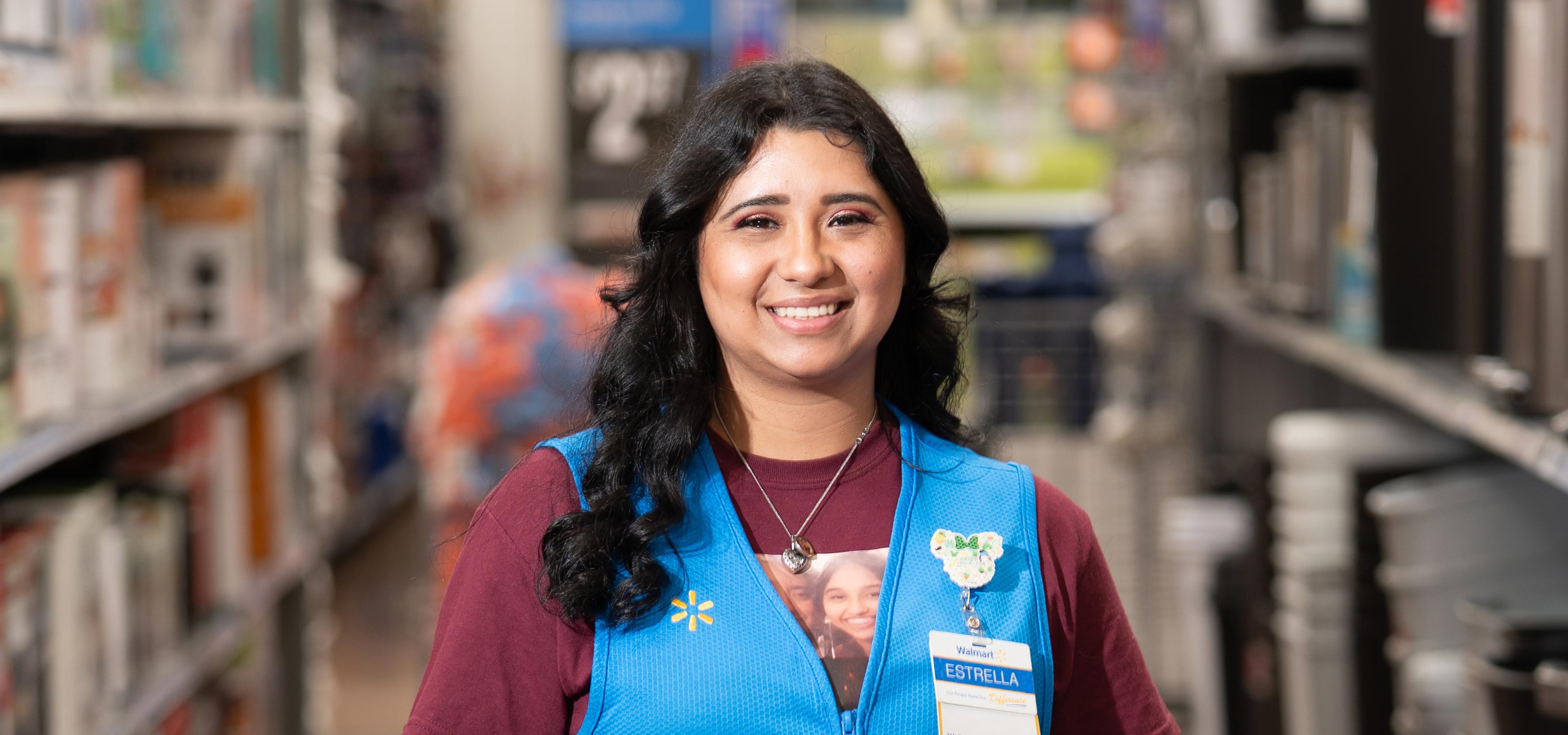 Walmart associate Estrella smiles at the camera in Store 5245 in San Antonio, Texas.